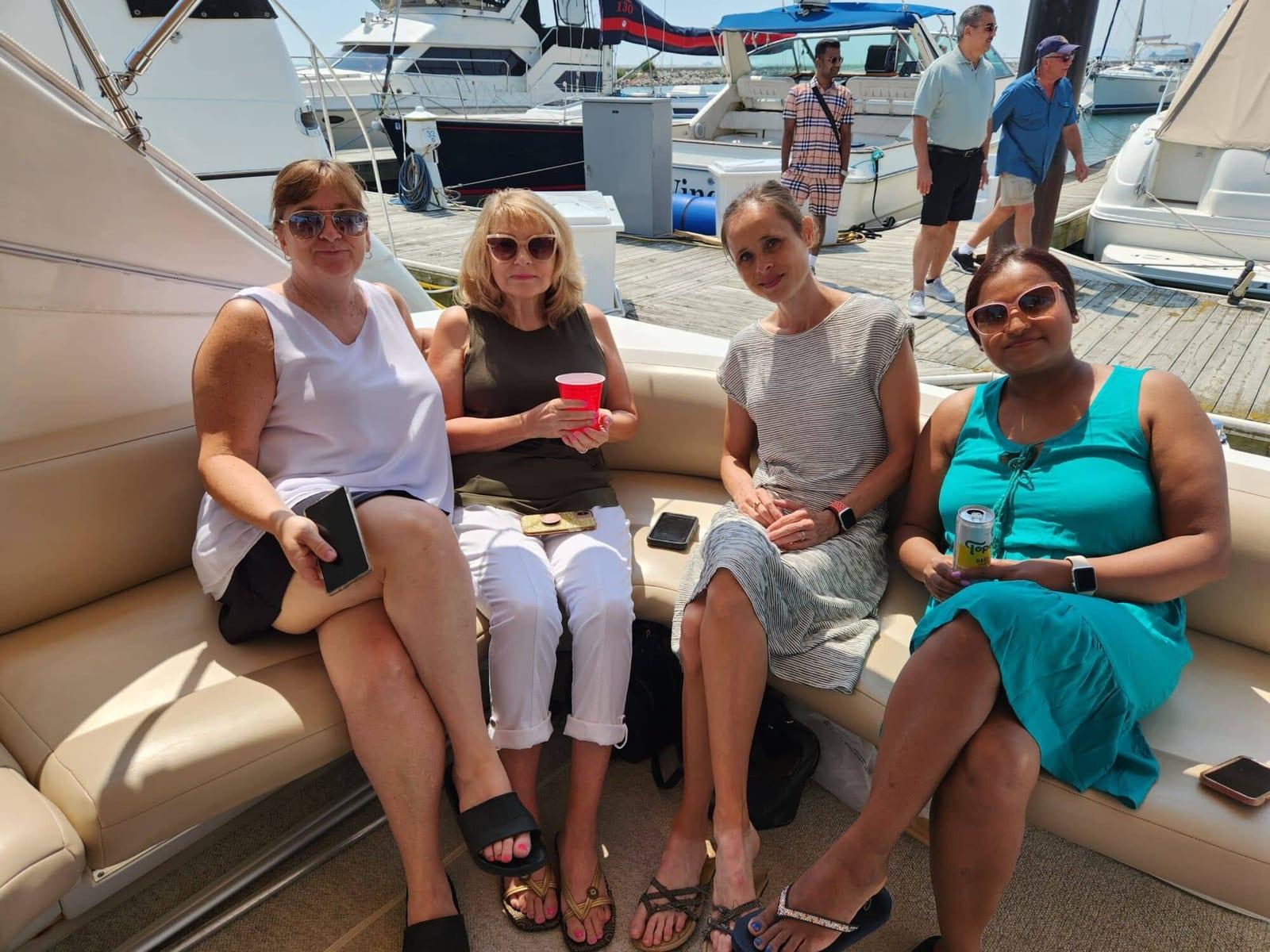 ISG teammates relaxing on a boat at the harbor